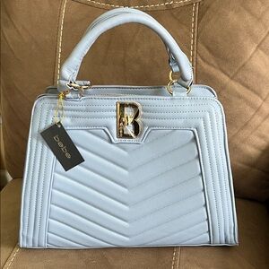 Bebe quilted chevron satchel bag, gold "B" logo, light blue color.